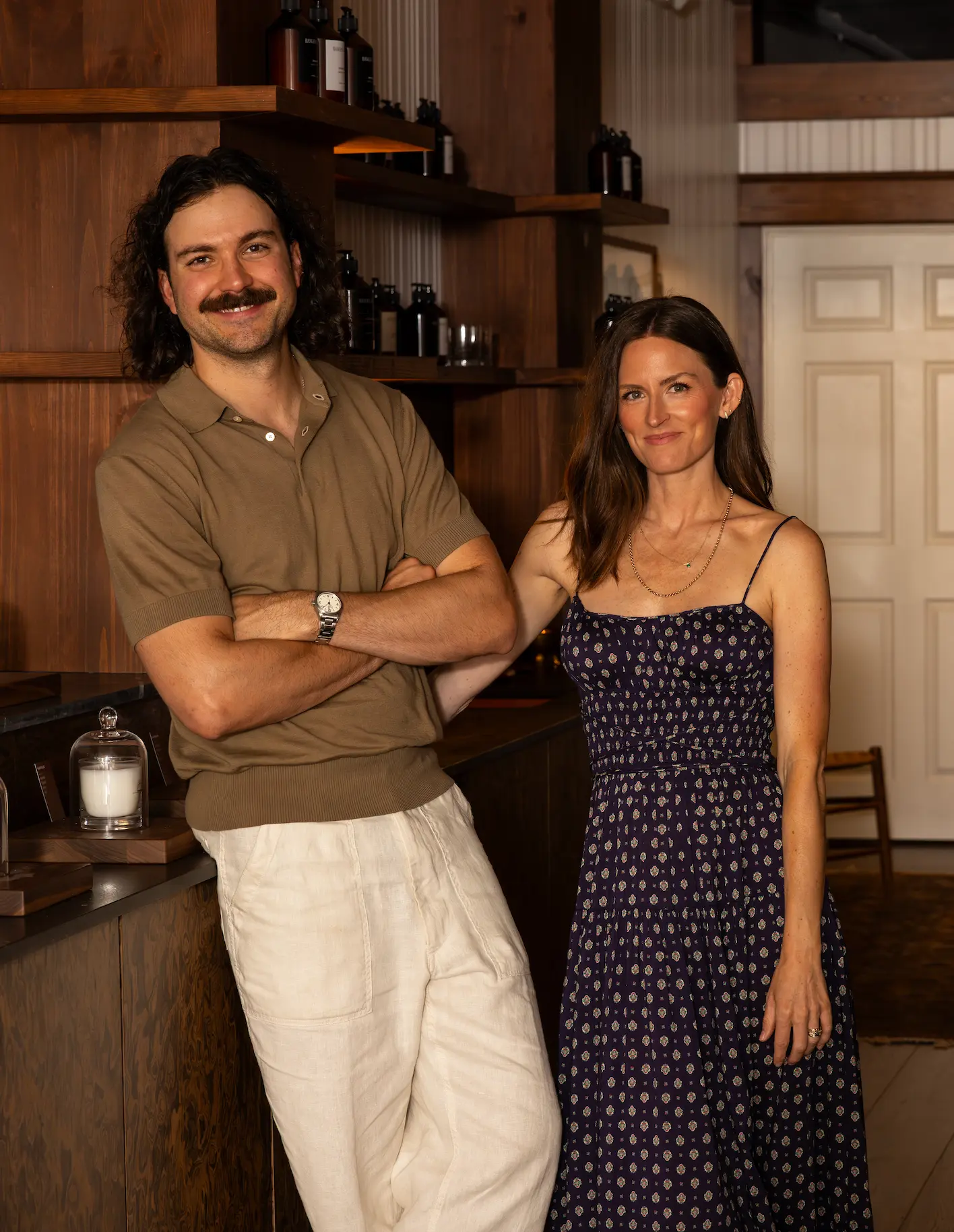 Steve and Jordan Soderholm in the Ranger Station Nashville house, candles on the counter beside them.